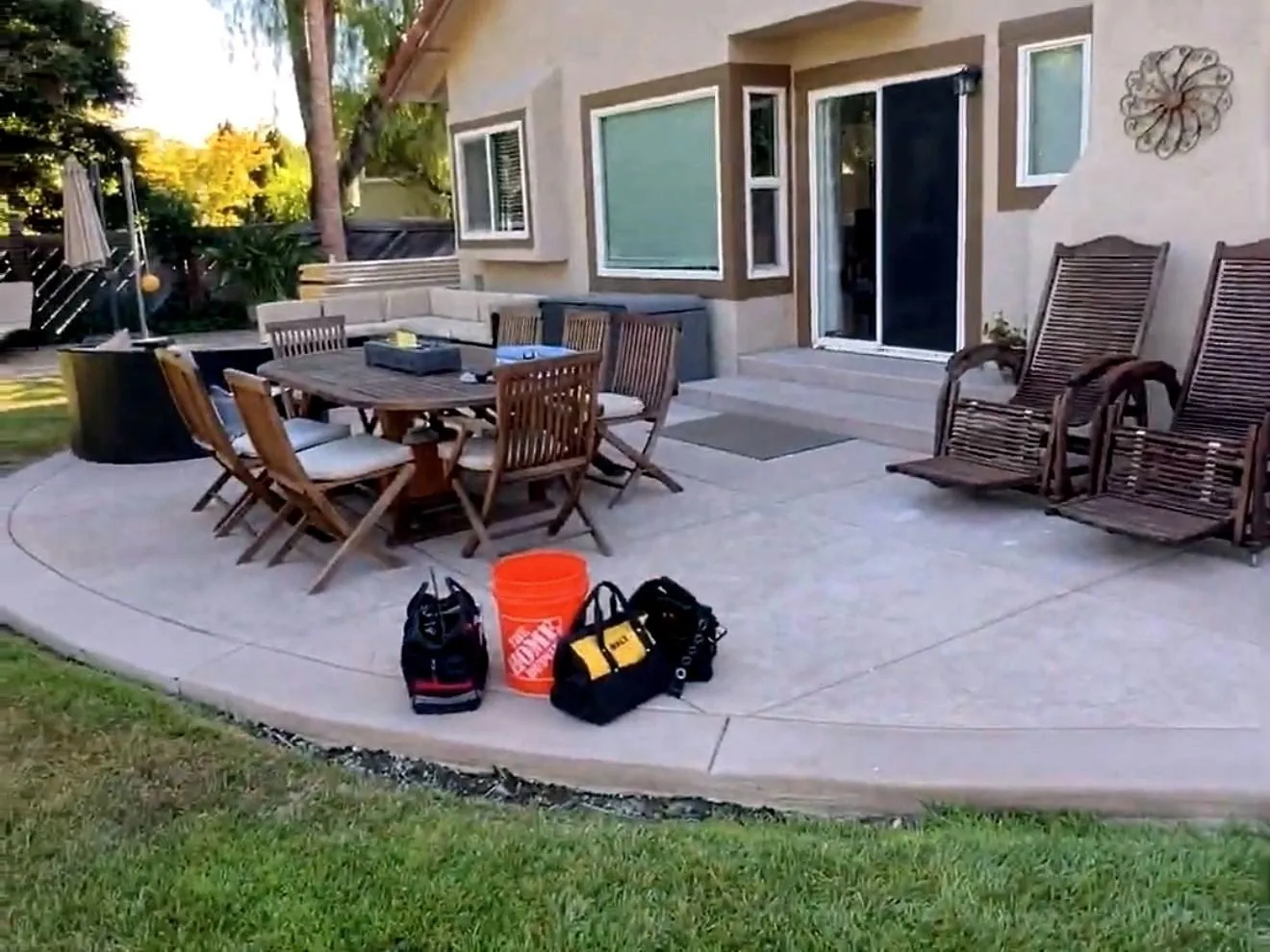 Before — Backyard before and after a timber covered patio was built onto the back of the house