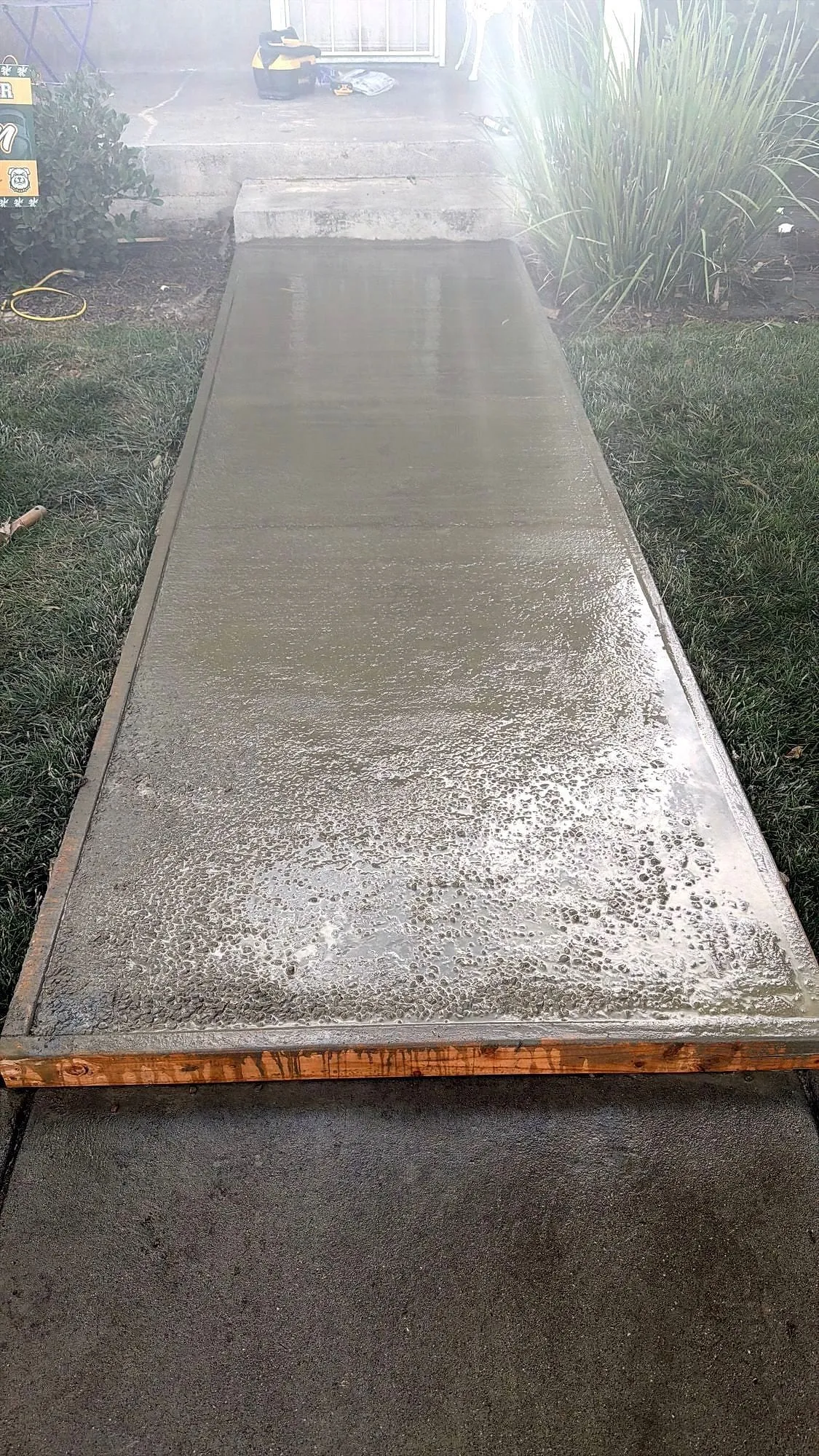Fresh path poured and floated in beside it.