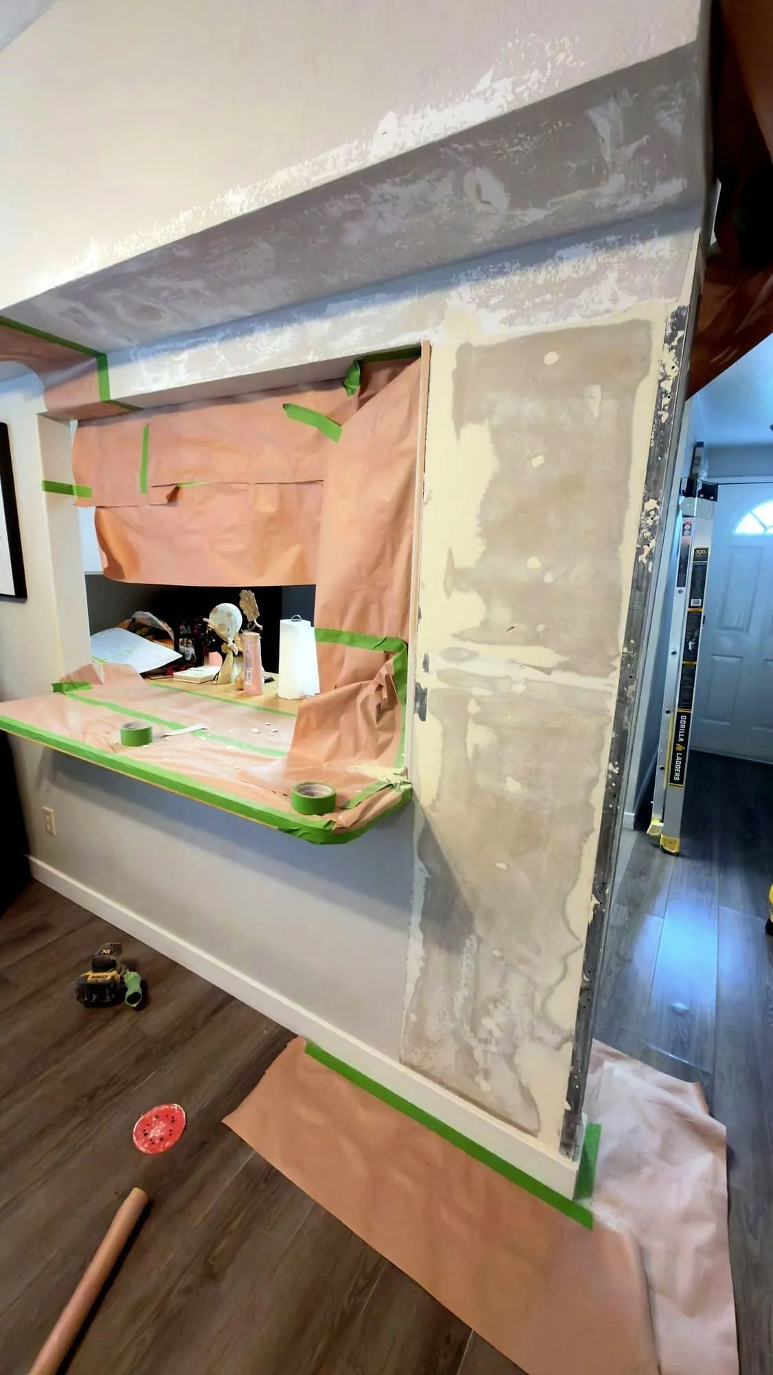 Opening cut and framed, plastic up and insulation exposed before the board goes back.