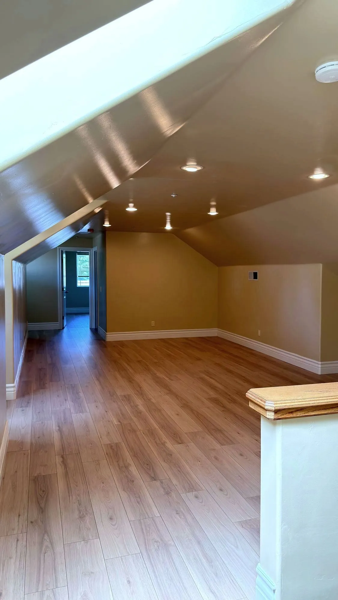 Finished floor run through a converted attic room.