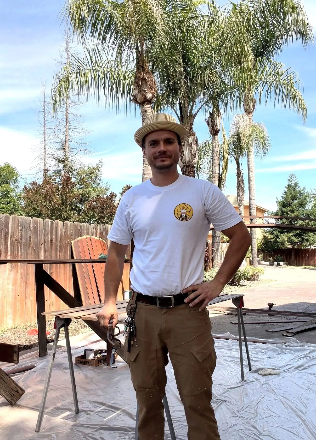 Serj, the Handyman in Hat, on a Sacramento job in his straw pork-pie hat and a shirt with the mark on it
