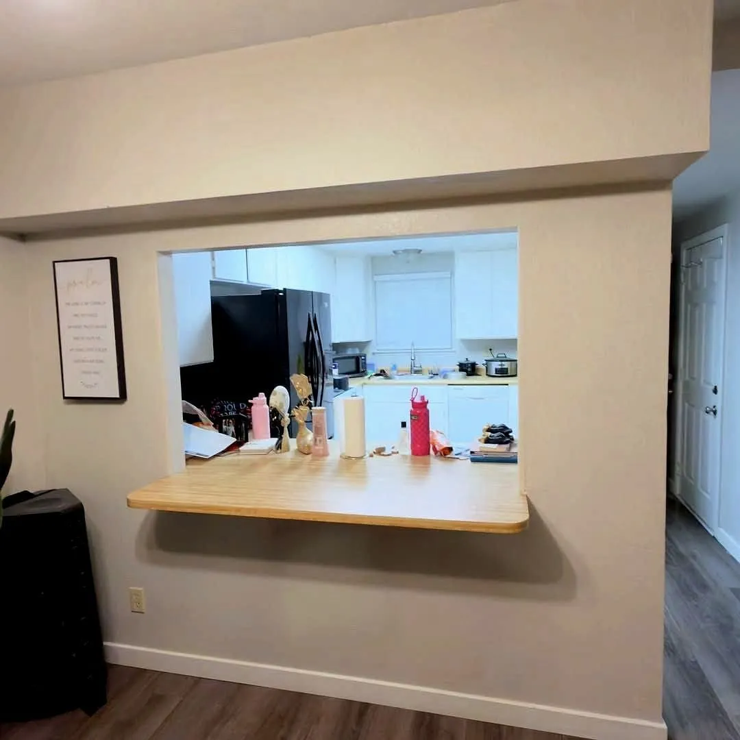 Finished drywall pass-through wall, patched, textured and painted