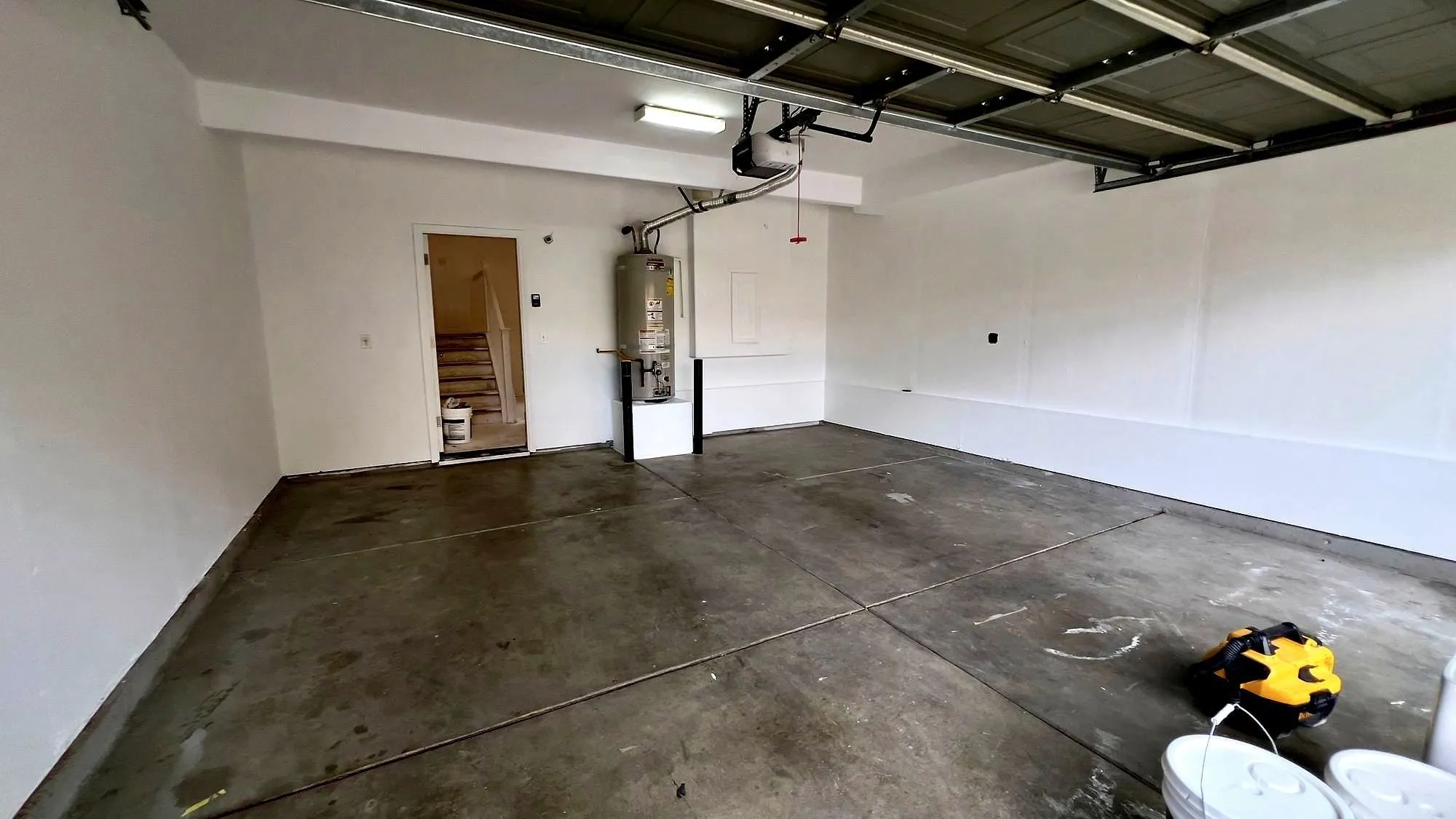 Garage cleared, painted and ready for what goes on the walls.