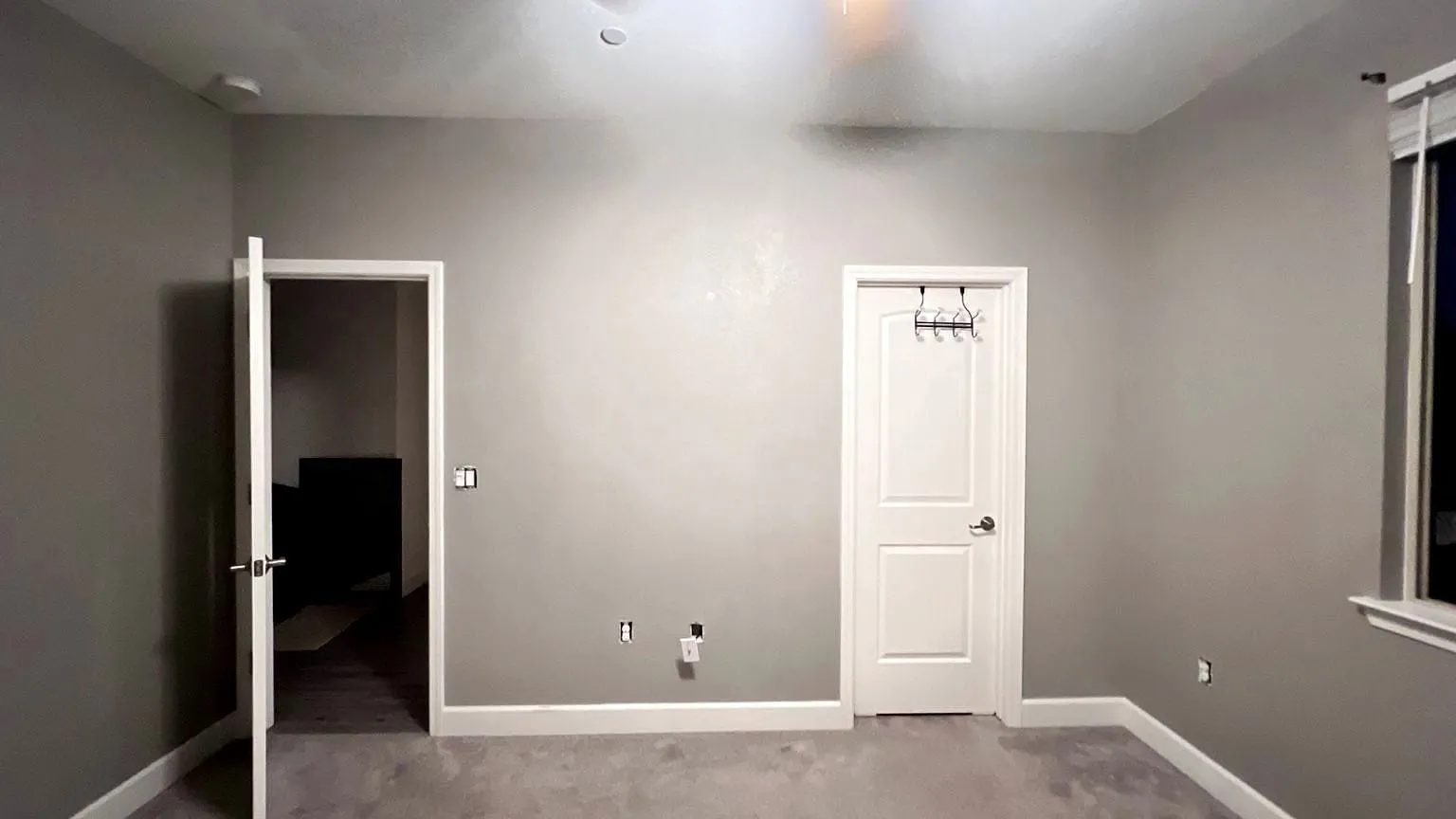 Wall and ceiling finished and painted. No patch showing in the light.