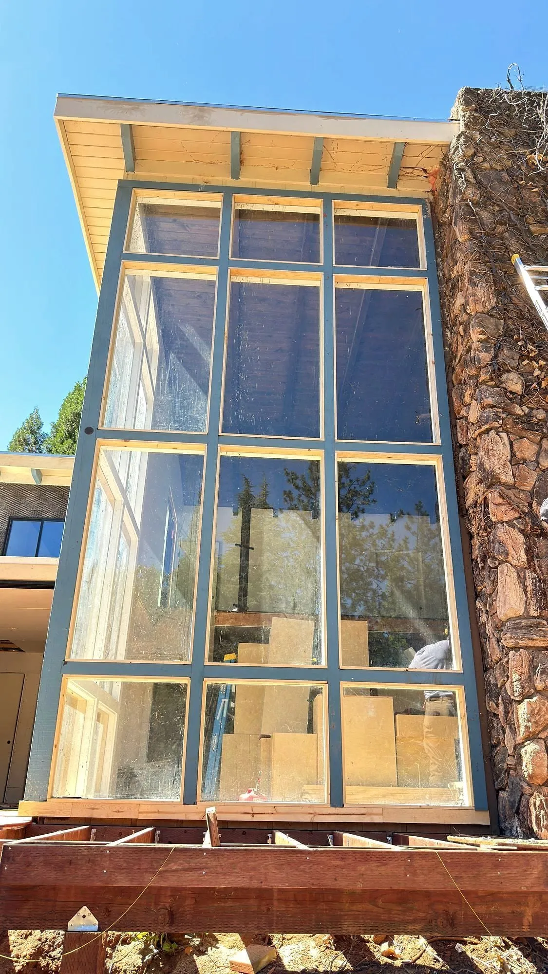 Tall window wall trimmed out, every join cut on site.